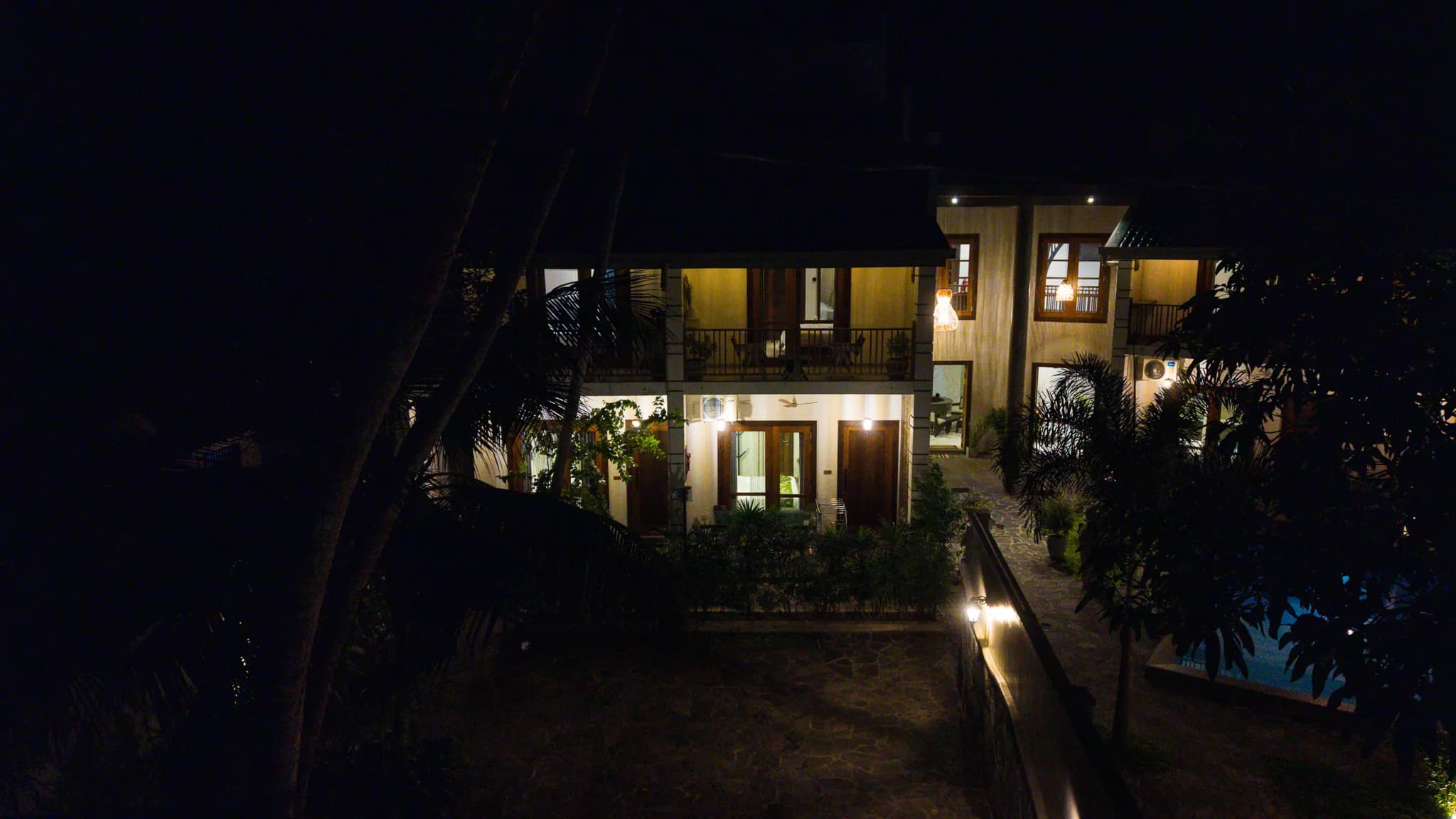 Night aerial of the courtyard and pool