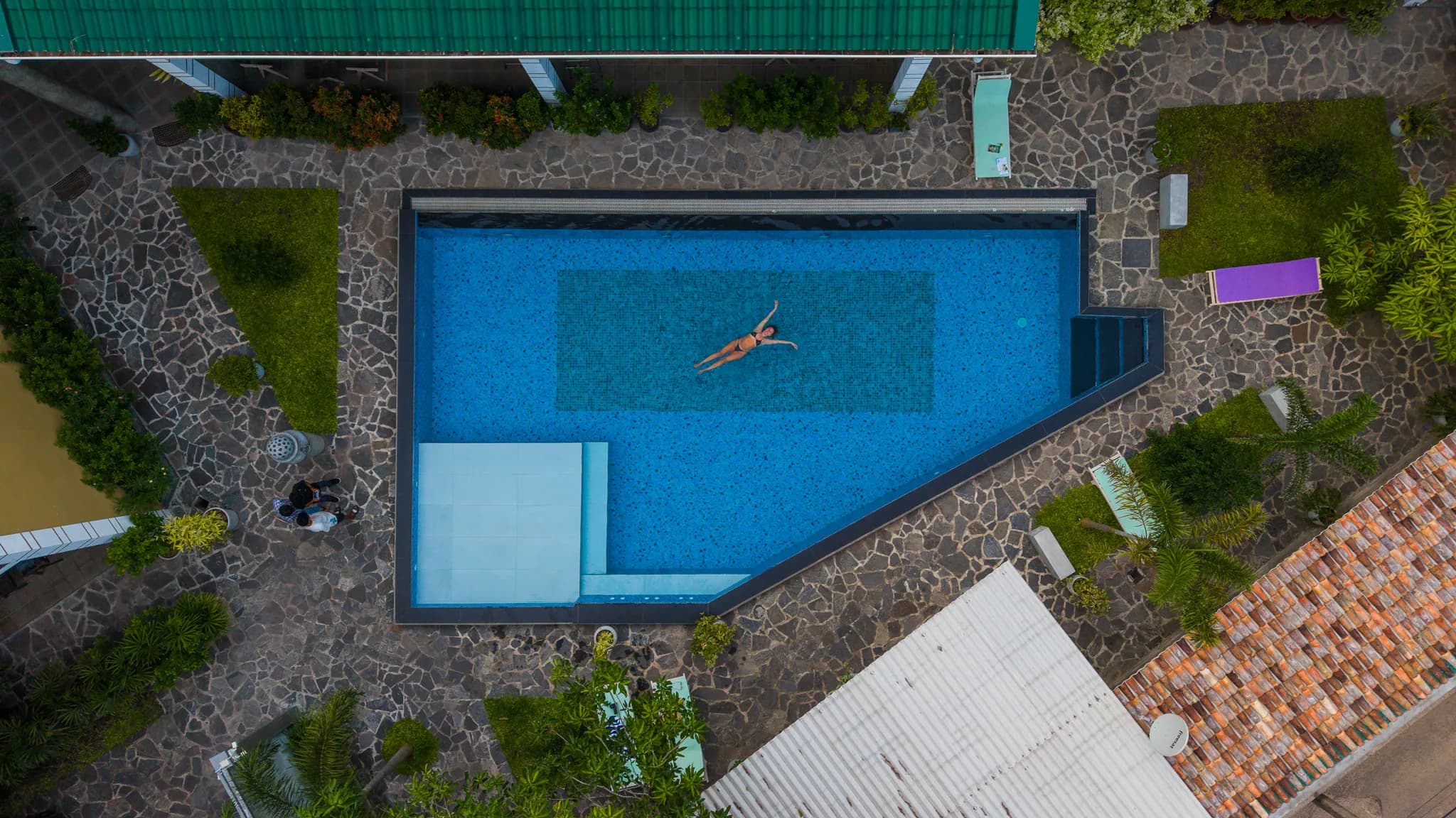 Top-down aerial of a swimmer in the pool