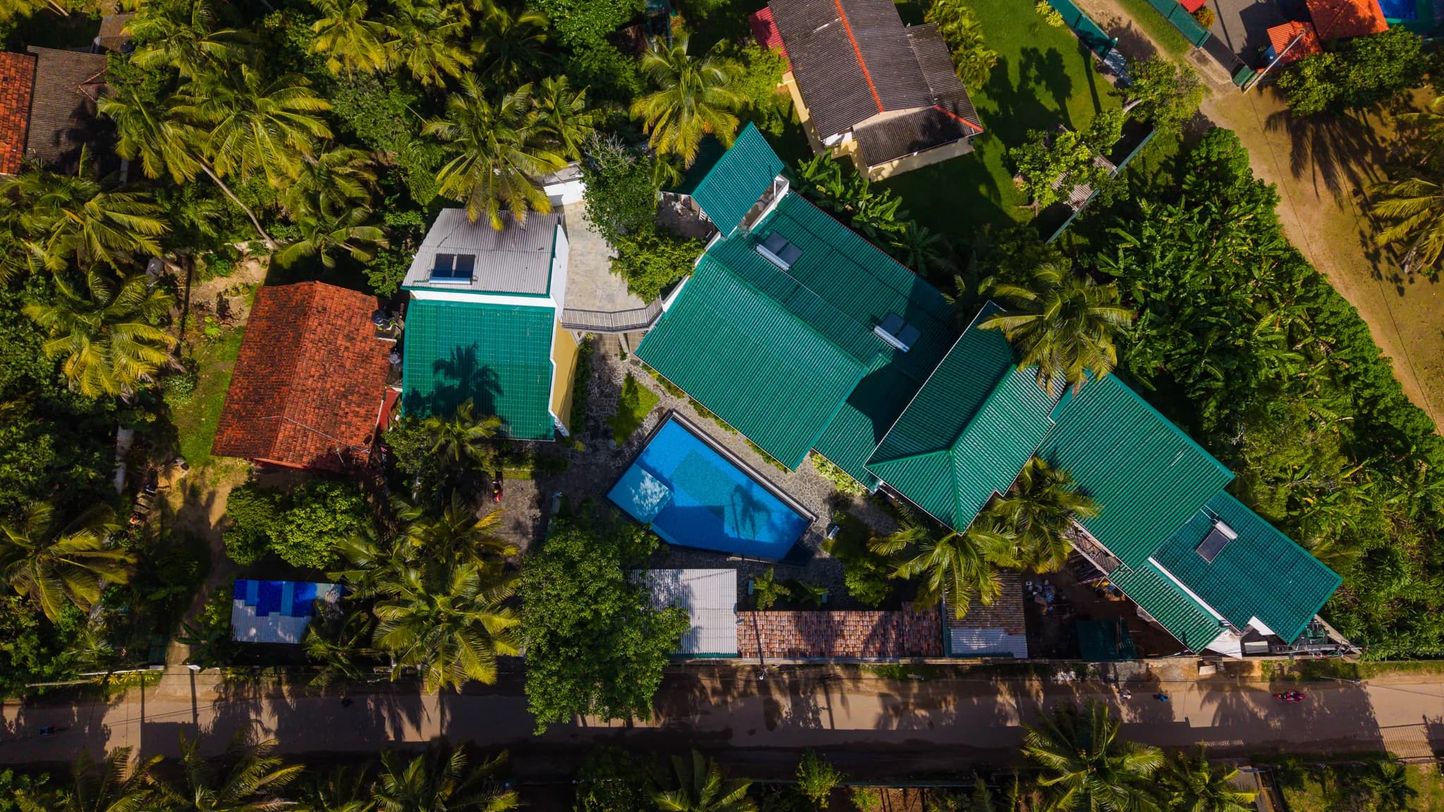 Top-down aerial of the hotel, pool and gardens