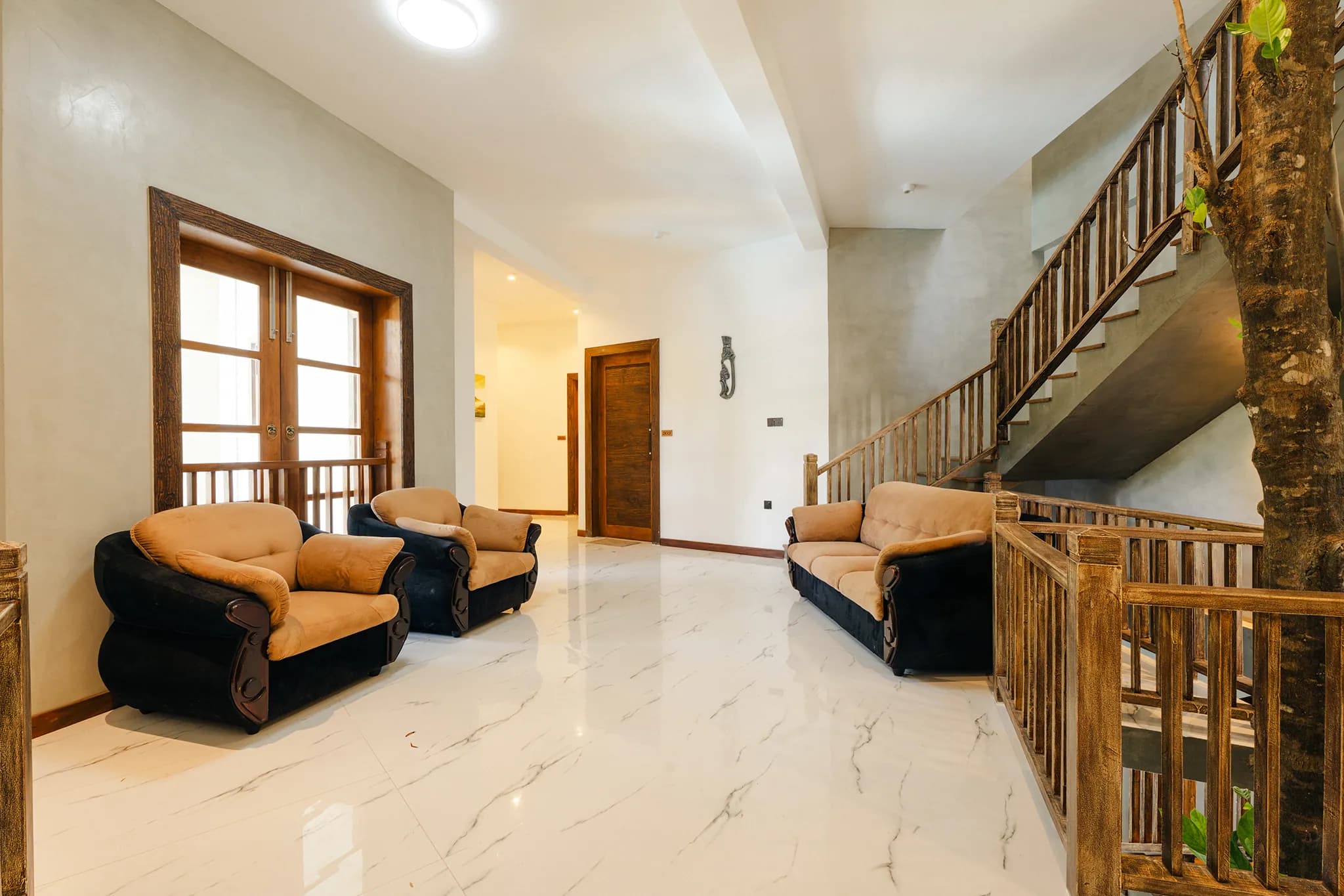 Lounge seating beneath the lobby staircase