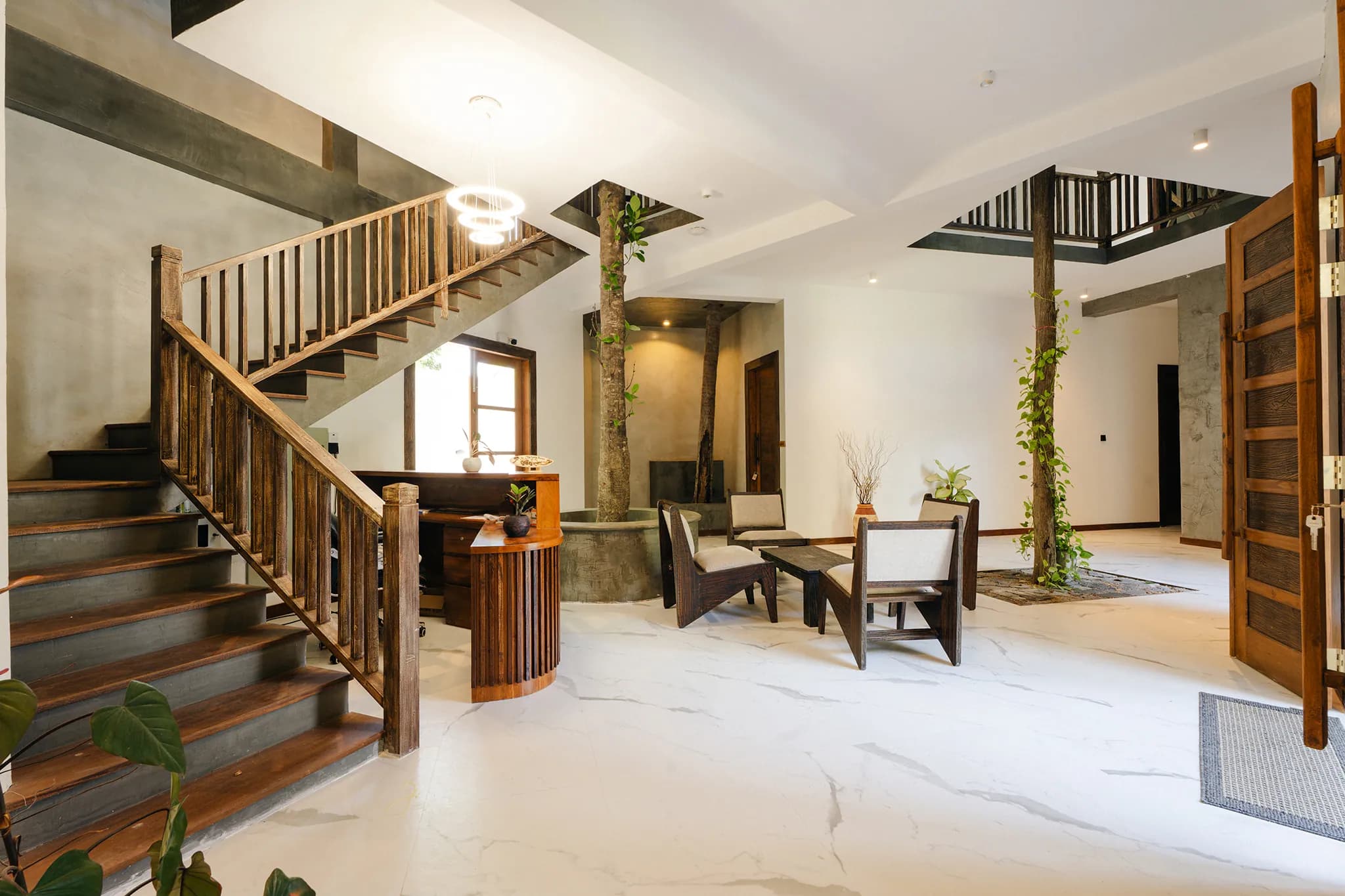 Lobby with marble floor and timber balustrades