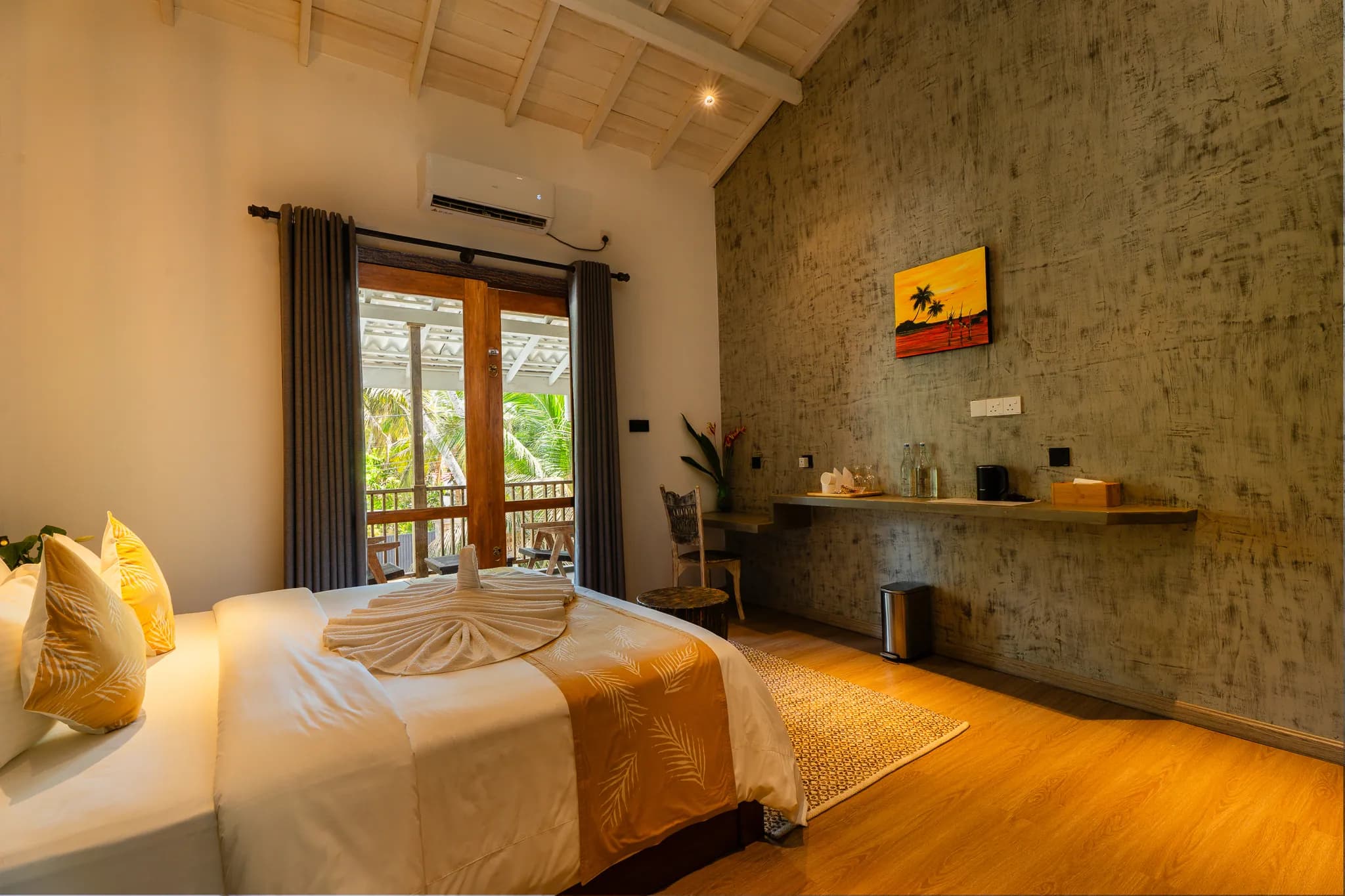 King bed, wall shelf and artwork in a first-floor room