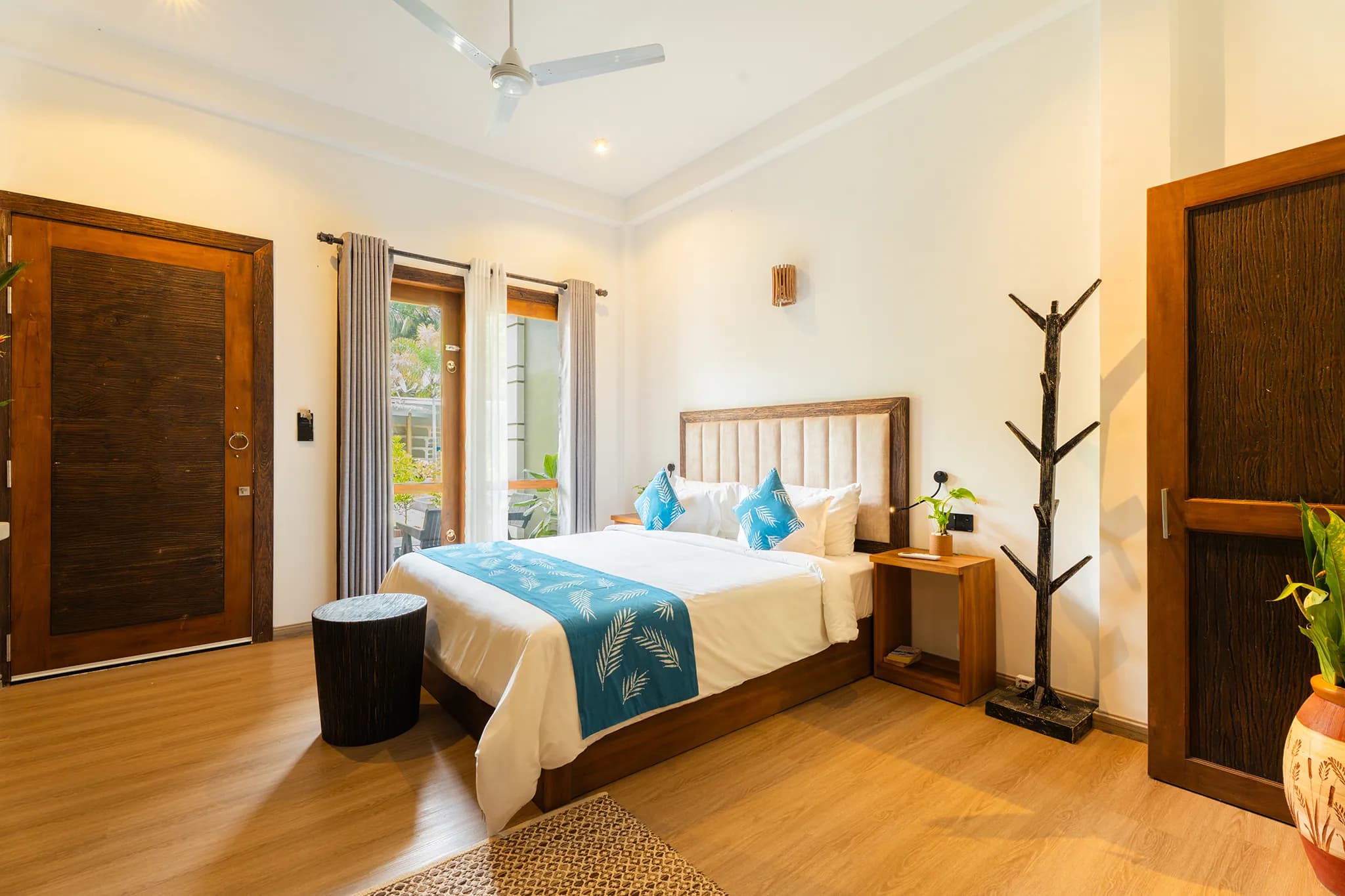 King room with timber door and bedside shelf