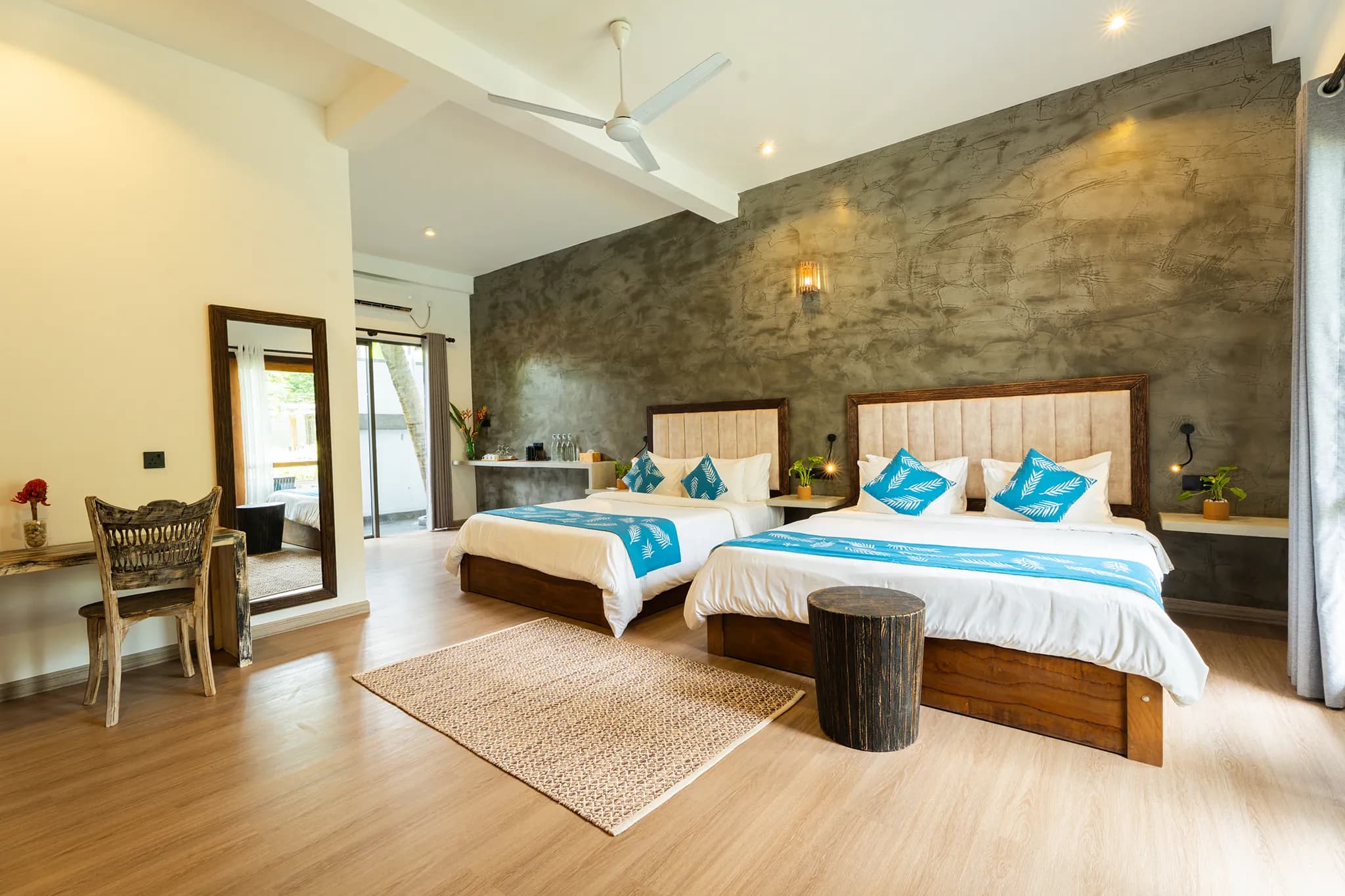 Family suite with two beds, desk and large windows